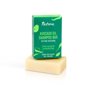 a bold close-up of our nourishing avocado oil shampoo bar with rich green accents