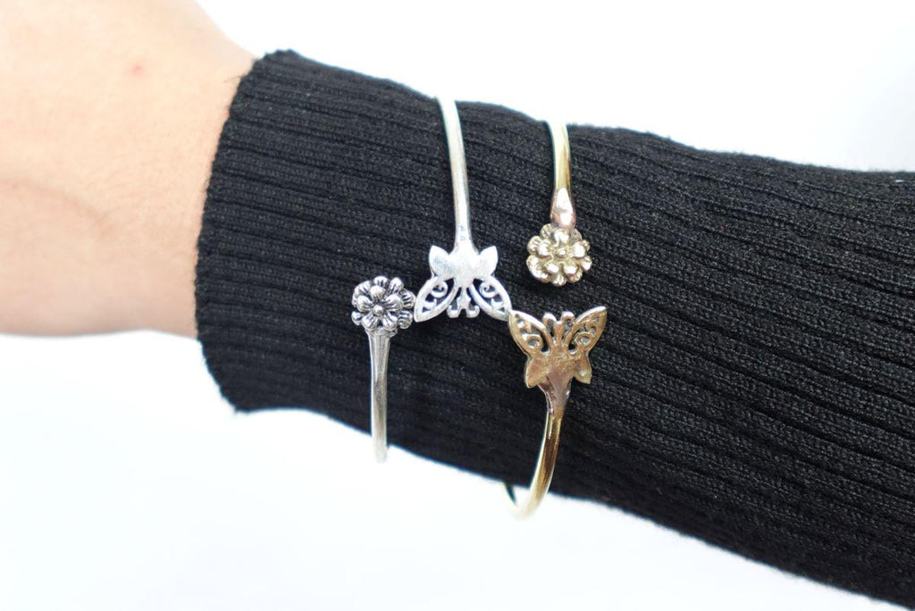 Whimsical Butterfly Open Bangles - Adjustable bangles featuring butterfly and flower motifs in brass and silver.