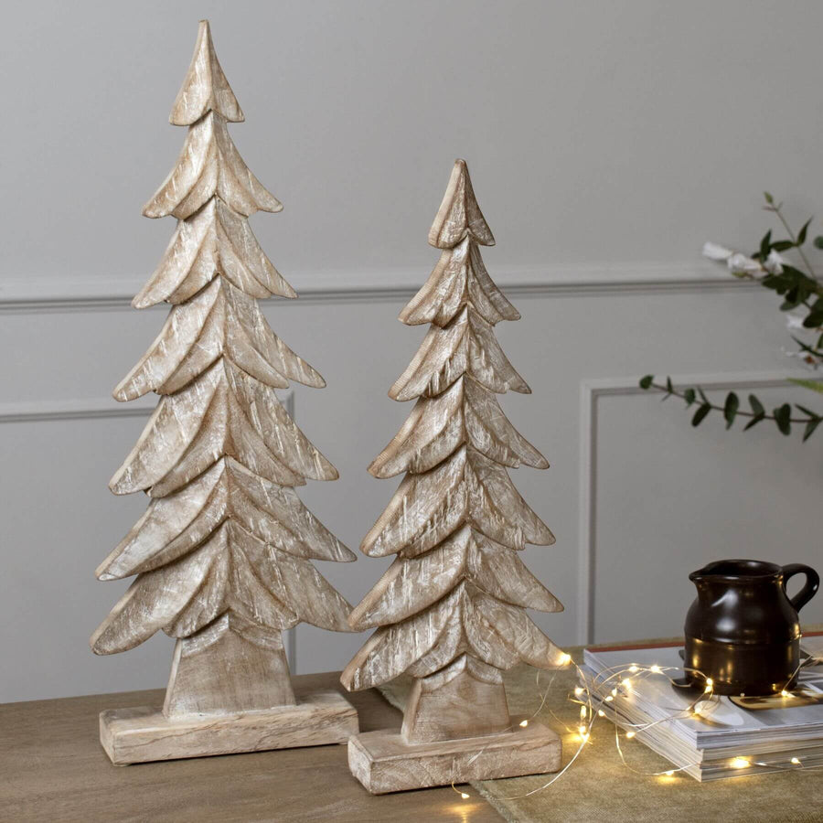 Hand-carved wooden Christmas tree with intricate details, rich brown finish, perfect for rustic or modern holiday decor. by Sostter at brixbailey.com