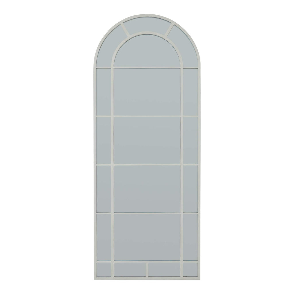 White arched window mirror with Gothic-inspired detailing in wood frame, enhancing room light and space perception. by Sostter at brixbailey.com
