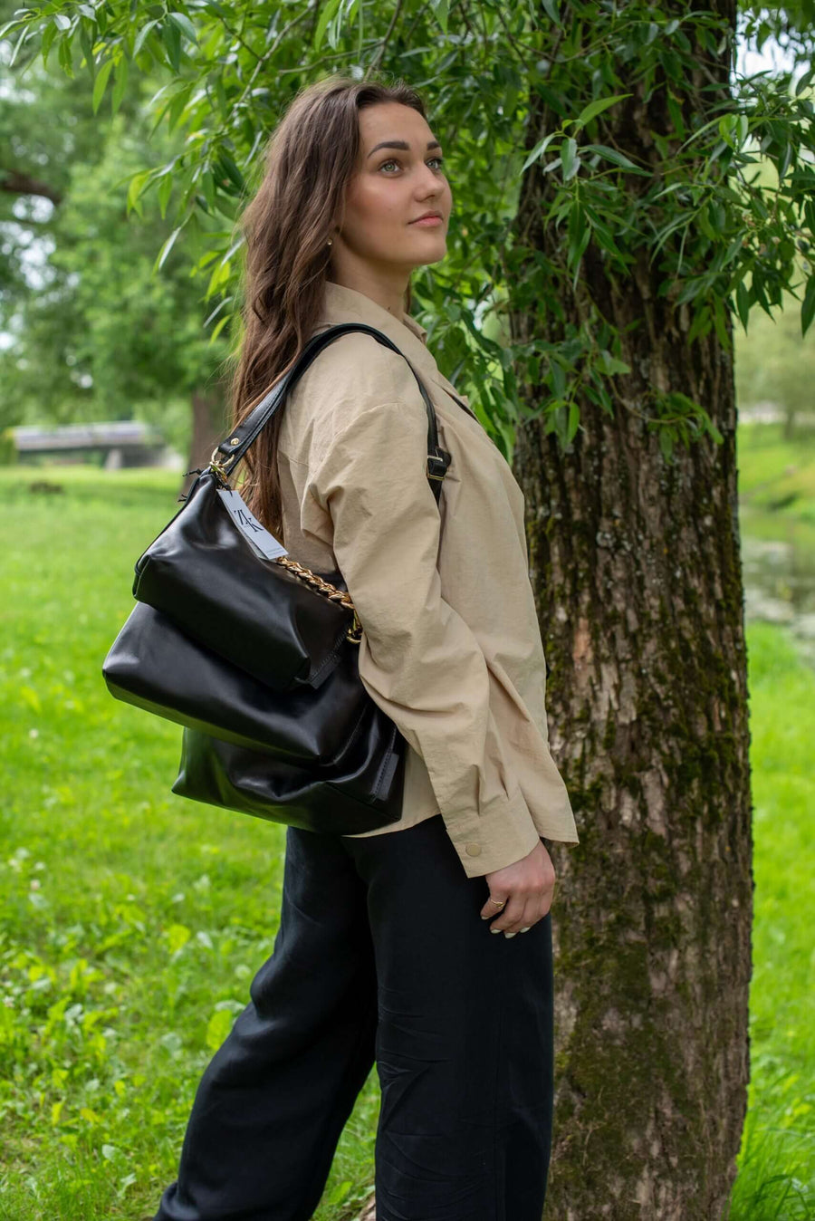 Classic Black Handbag – Timeless Elegance & Modern Versatility by Zelma Kraft at brixbailey.com