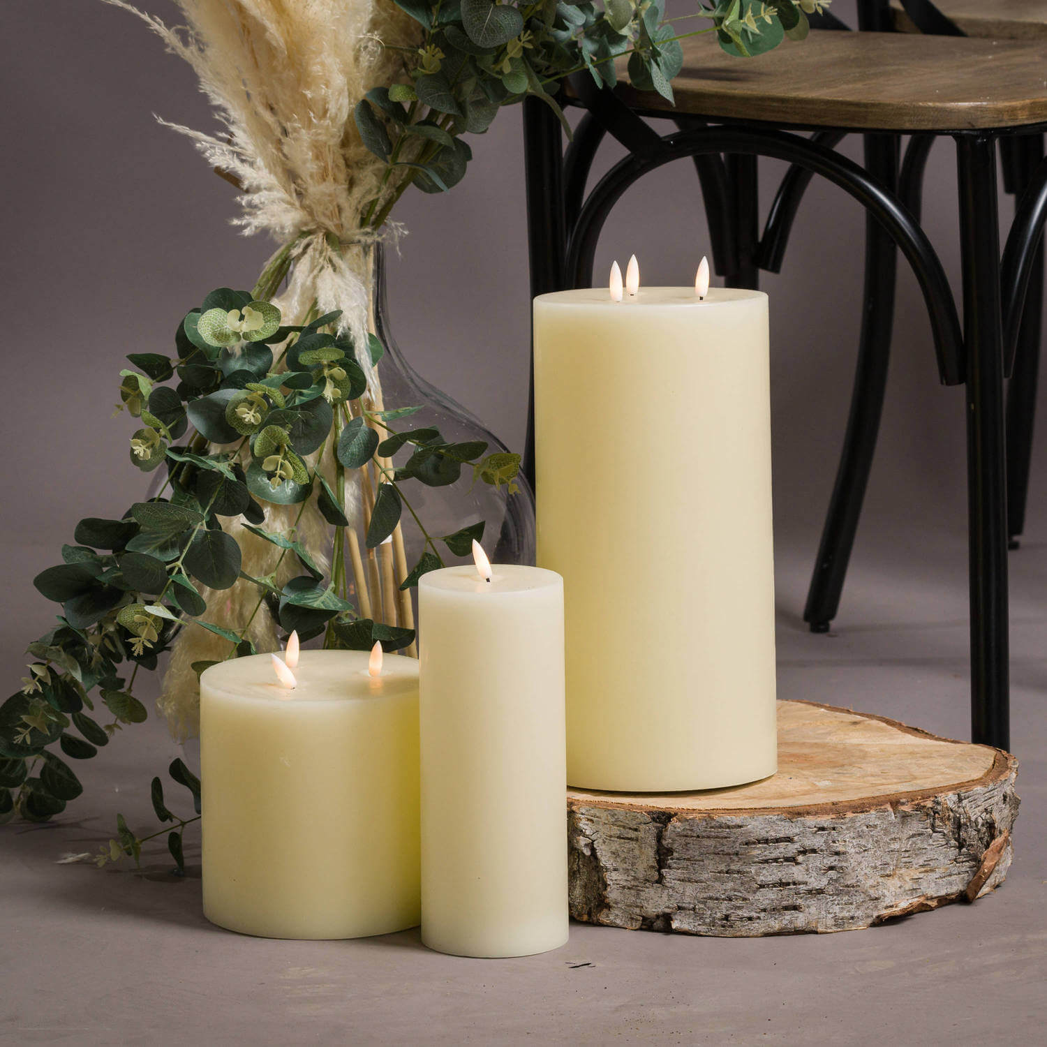 Realistic ivory LED wax candle with flickering amber flame, safe battery-operated home decor by Sostter at brixbailey.com
