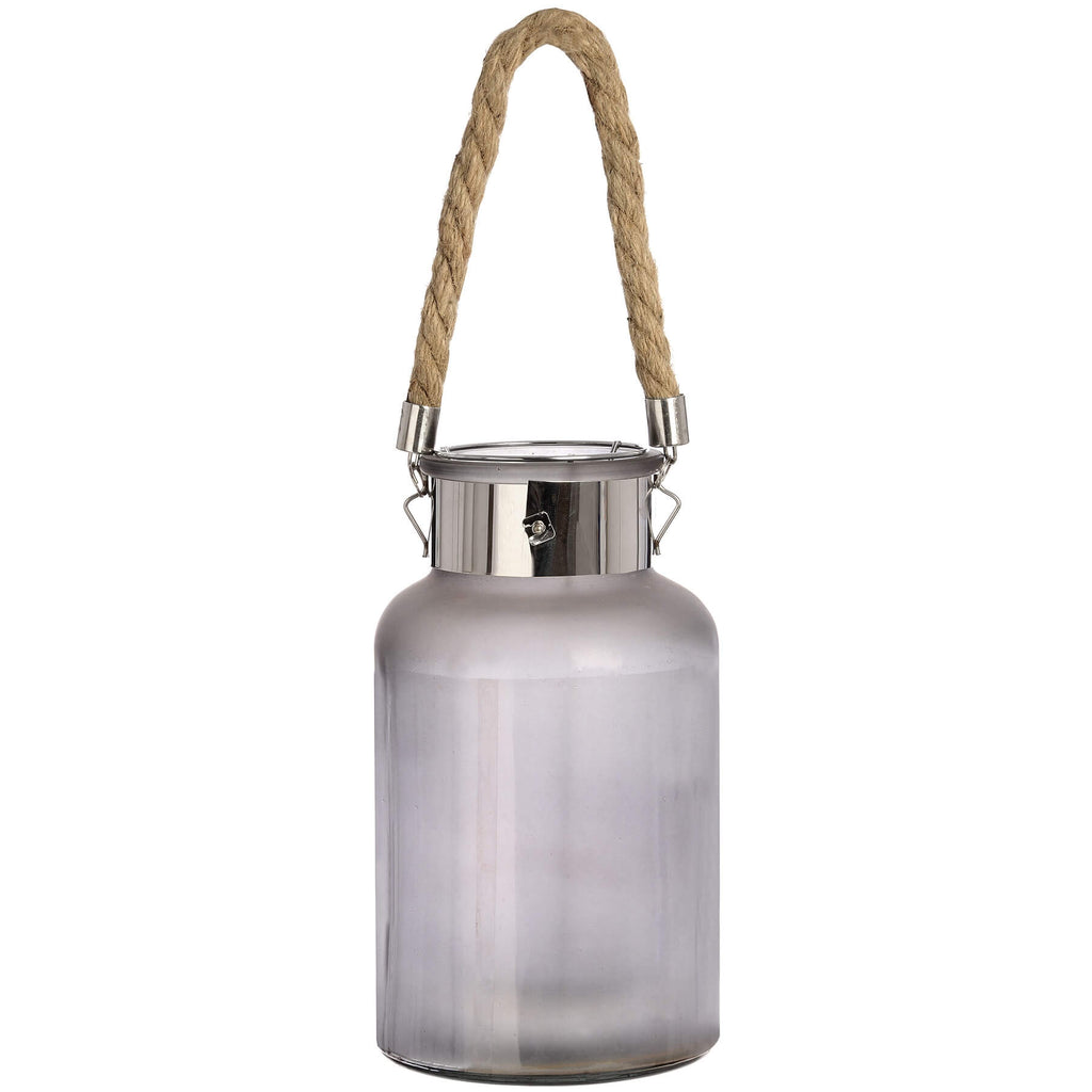 Frosted grey glass lantern with rope handle and warm LED glow, creating a starlight effect for indoor or outdoor decor. by Sostter at brixbailey.com