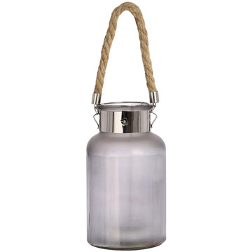 Frosted grey glass lantern with rope handle and warm LED glow, creating a starlight effect for indoor or outdoor decor. by Sostter at brixbailey.com