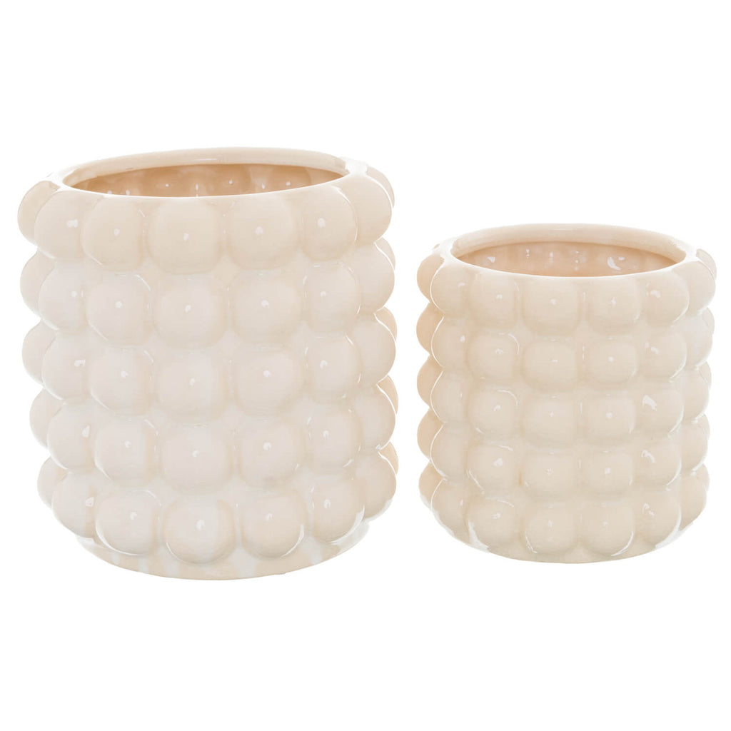 Handcrafted cream ceramic planter with bubble texture, perfect for tabletop plants or floral arrangements. by Sostter at brixbailey.com