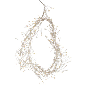 Warm white LED cluster string lights with 432 mini bulbs, silver wiring, and 8 lighting sequences for cozy ambiance.by Sostter at brixbailey.com