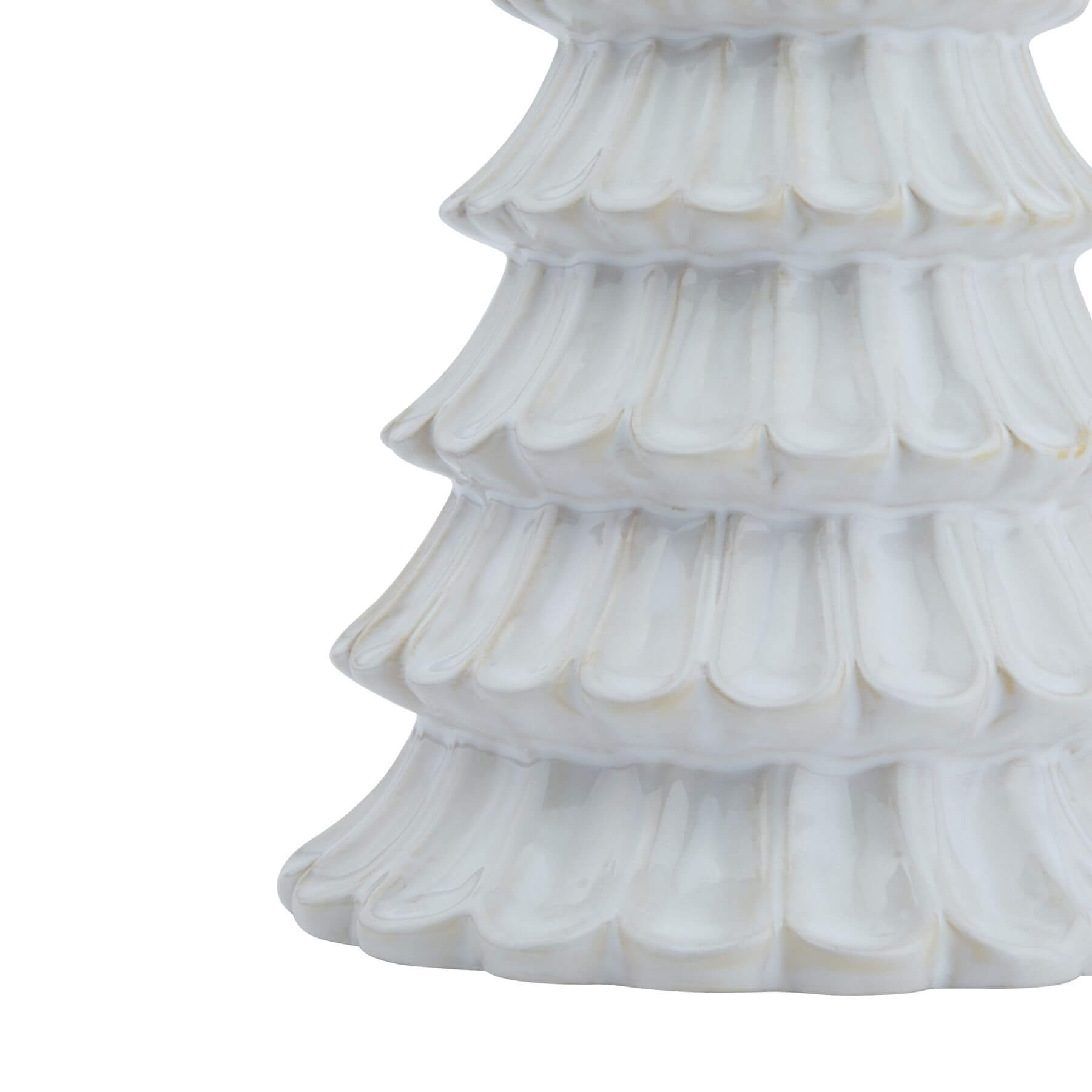 Handcrafted white ceramic fir tree sculpture with minimalist Nordic design, casting geometric shadows. by Sostter at brixbailey.com