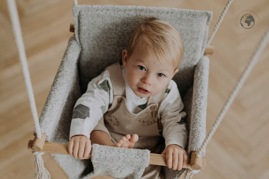Discover Comfort and Sustainability with the Bouclé Cloth Baby Swing by Nofi KIDS at www.brixbailey.com