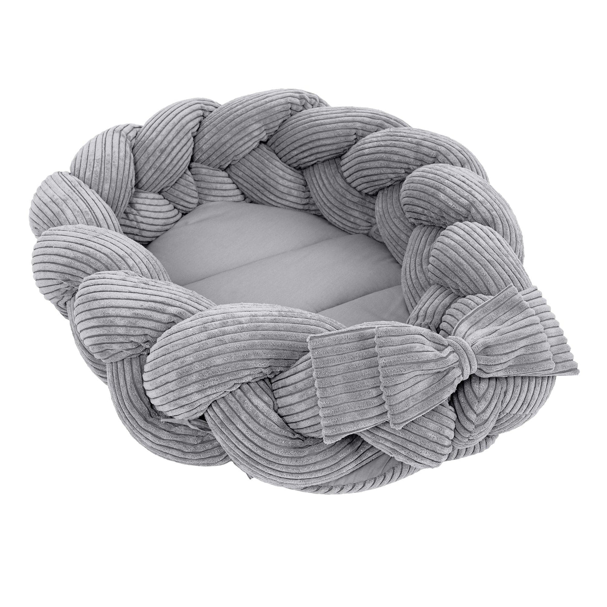 confident shot of a soft grey baby nest with a stylish braided bumper
