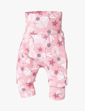 soft cotton baby shorts with a dragonfly print, shown on a cozy nursery rug