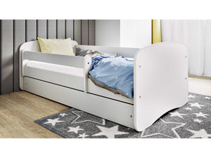 bold modern kids bed with safety guardrail and storage drawer in a bright nursery