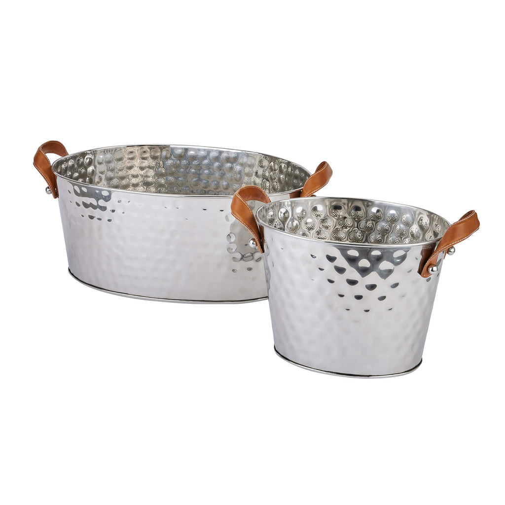 Silver champagne cooler with hand-hammered metal and leather handles, perfect for elegant entertaining by Sostter at brixbailey.com