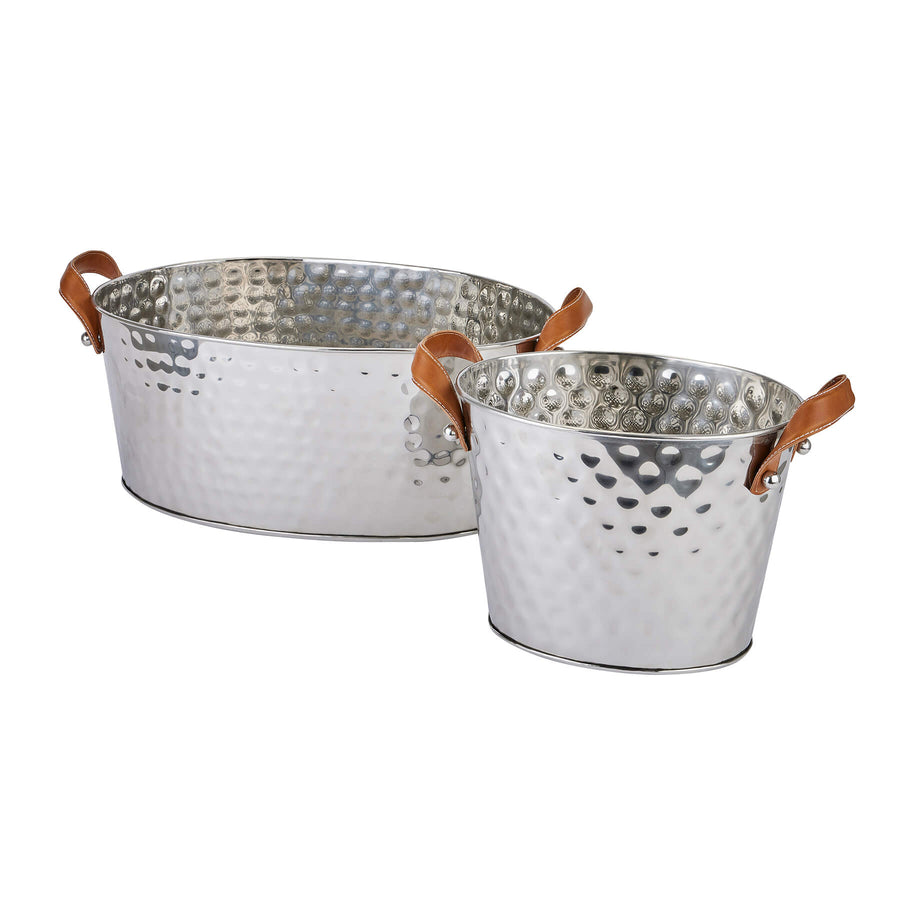 Silver champagne cooler with hand-hammered metal and leather handles, perfect for elegant entertaining by Sostter at brixbailey.com