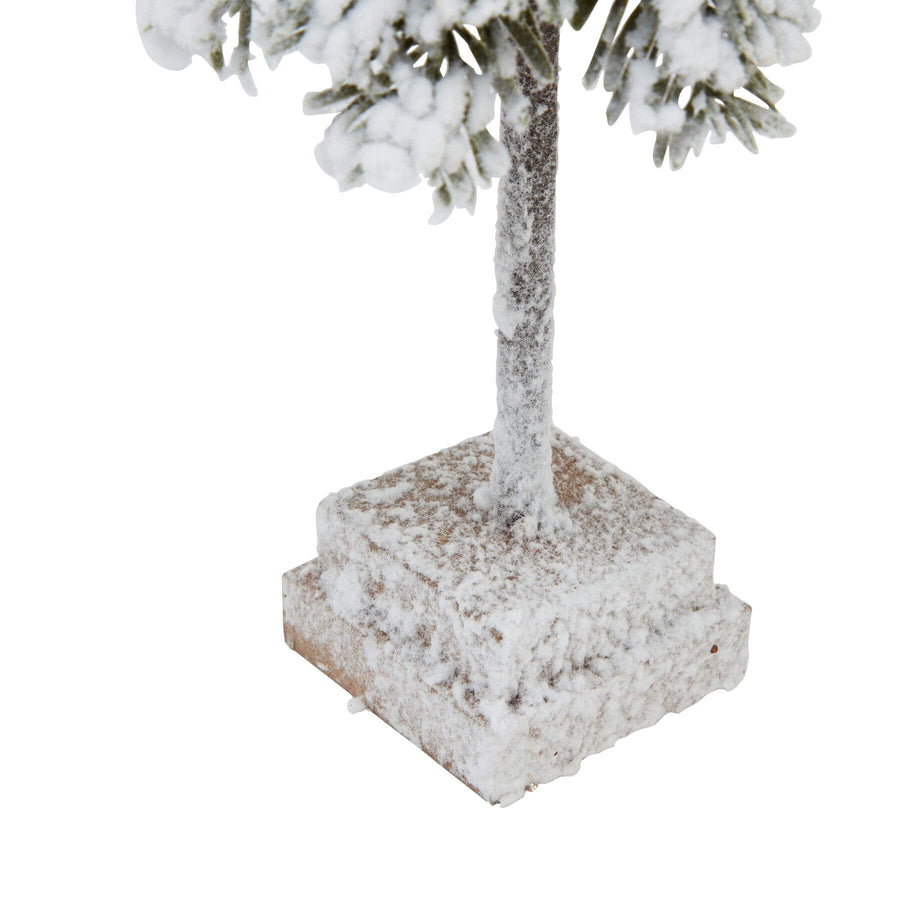 Handcrafted snowy cedar tree sculpture with realistic branches and wood base, perfect for winter decor. by Sostter at brixbailey.com
