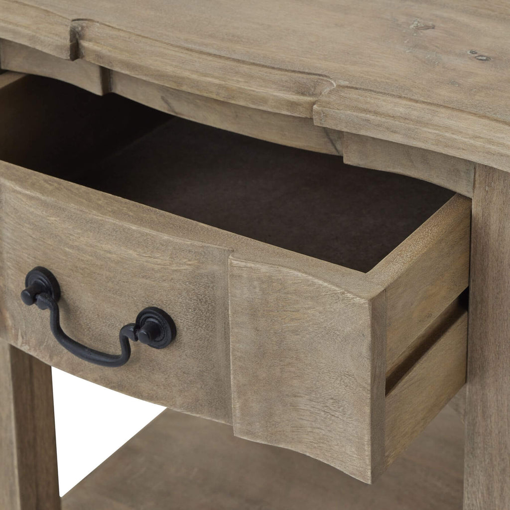 Handcrafted French provincial side table with hardwood construction, bleached wood finish, and black iron handles. by Sostter at brixbailey.com