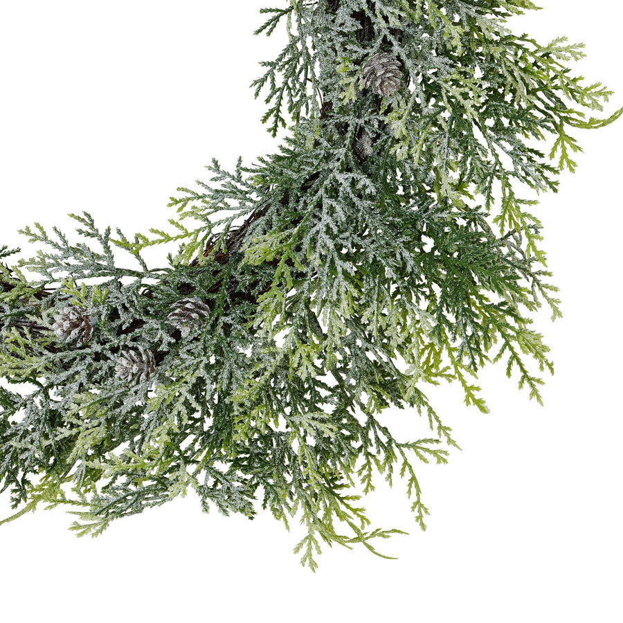 Frosted pine wreath with lifelike frost effect and natural pinecones, elegant white and green winter dÃ©cor centerpiece by Sostter at brixbailey.com