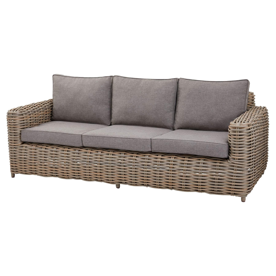 Premium beige 5-piece outdoor wicker set with coffee table and Olefin cushions on patio by Hill Interiors at brixbailey.com