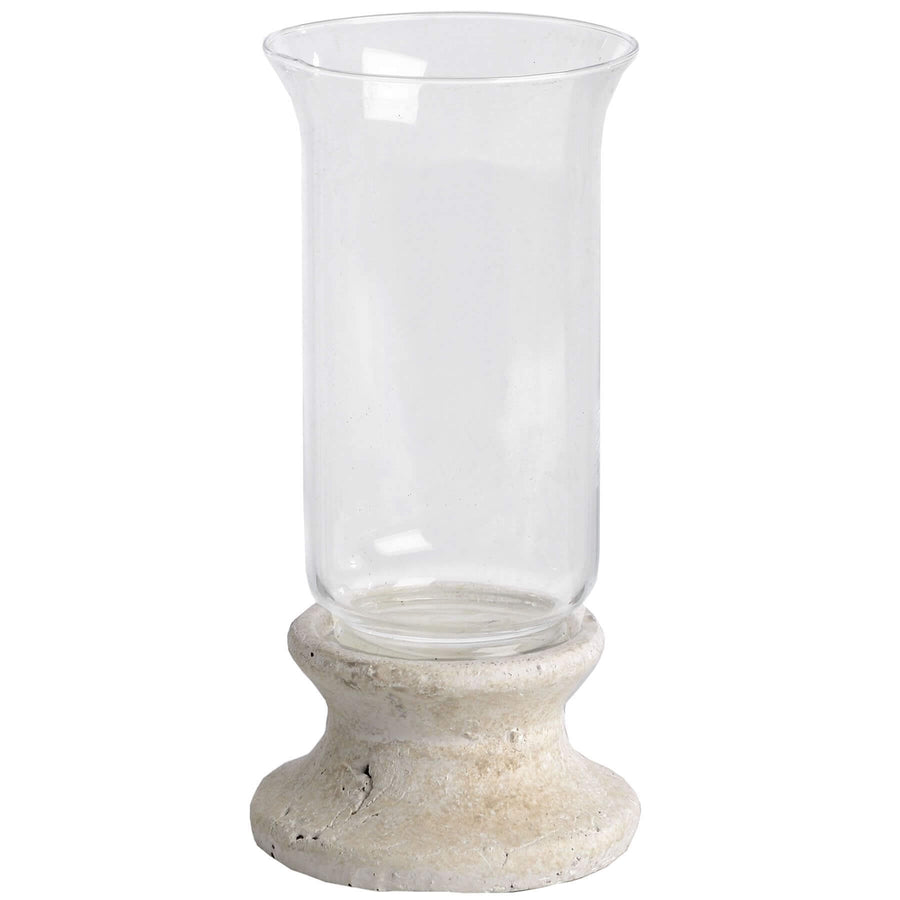 Handcrafted cream hurricane lantern with stone-effect base and antiqued patina, casting warm LED candlelight glow. by Sostter at brixbailey.com