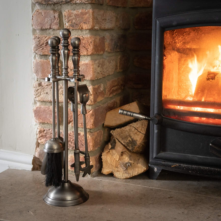 Antique pewter fireplace companion set with tongs, poker, shovel, brush, and stand for classic hearth elegance by Sostter at brixbailey.com