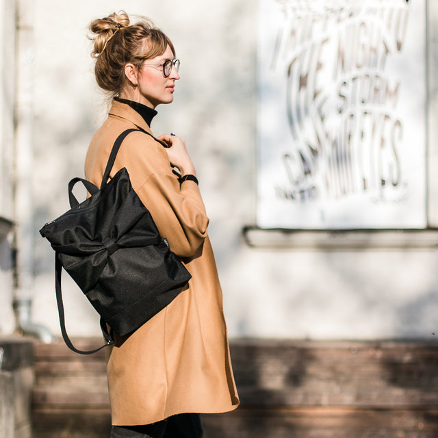 Chic Black Bow Backpack – Waterproof & Stylish for Everyday Use by Muni at brixbailey.com