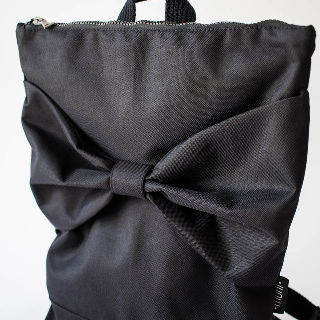 Chic Black Bow Backpack – Waterproof & Stylish for Daily Use by Muni at brixbailey.com