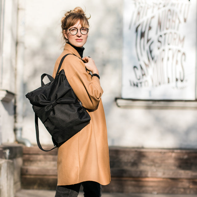 Chic Black Bow Backpack – Waterproof & Stylish for Daily Use by Muni at brixbailey.com