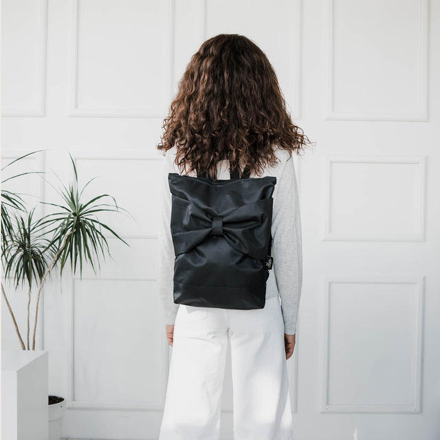 Stylish Black Bow Backpack - Waterproof & Comfortable by Muni at brixbailey.com