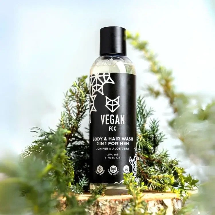 soft-lit bottle of vegan men's 2in1 body & hair wash with aloe vera, juniper berry, and fresh forest scent