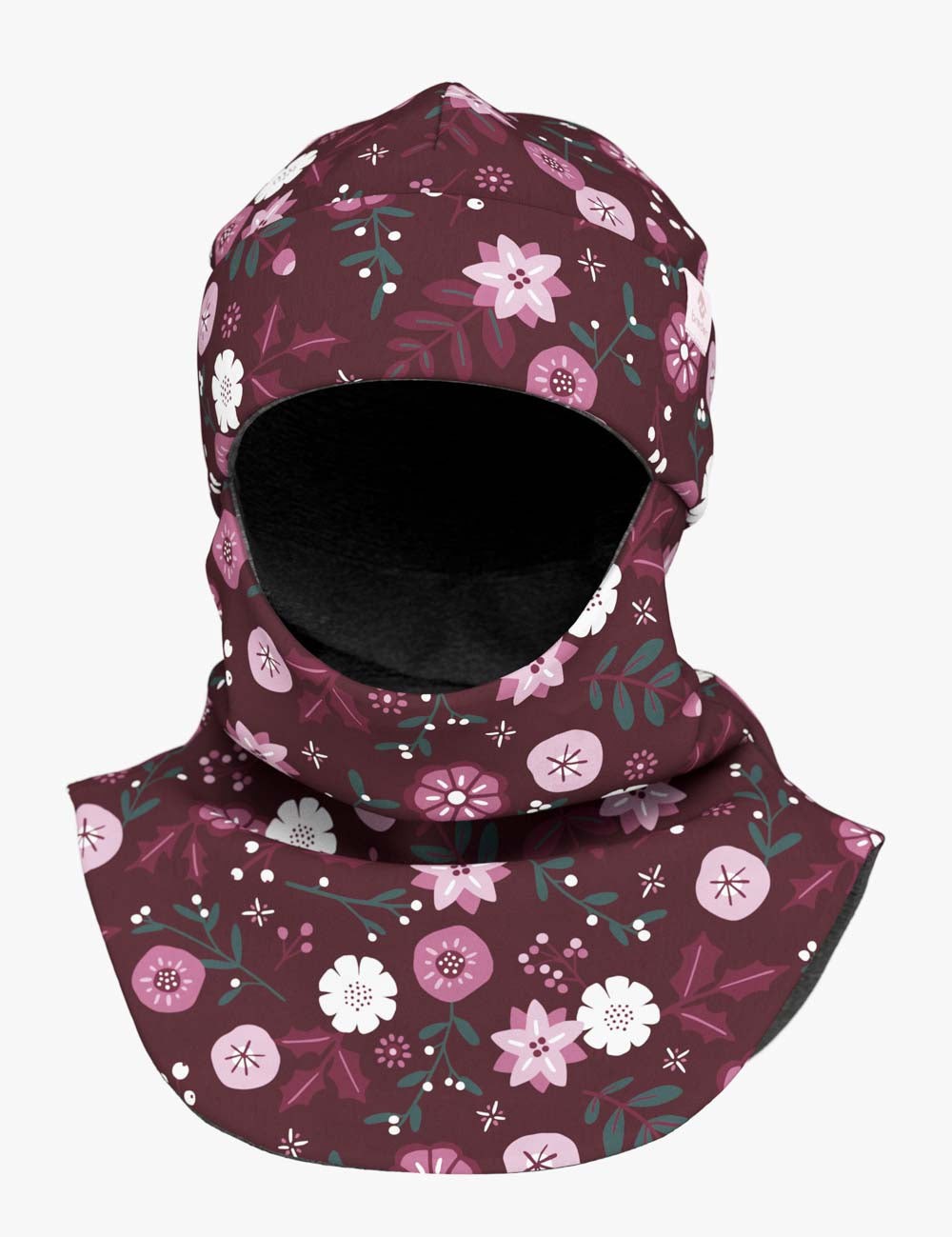 a child peeking playfully through a cozy merino balaclava with winter flowers