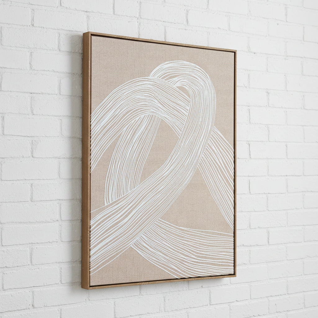 a bold minimalist line art print in a wood frame, dramatically lit from the side