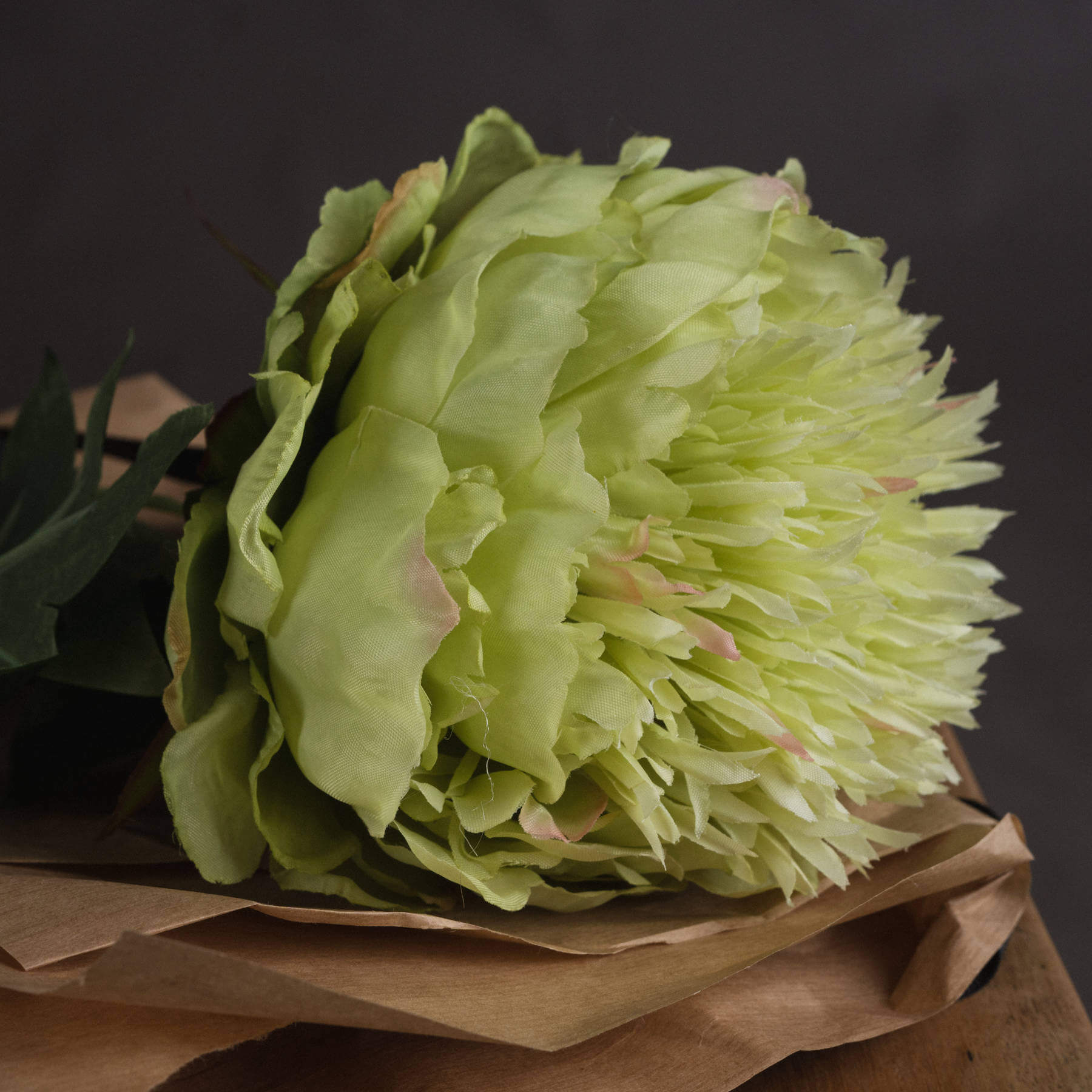 Lifelike green peony artificial stem with soft sage petals, perfect for farmhouse or contemporary home decor. by RoomLondon at brixbailey.com