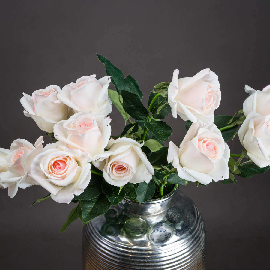 Lifelike artificial Palest Pink Tea Rose with green foliage, 65cm tall, perfect for home decor by Sostter at brixbailey.com