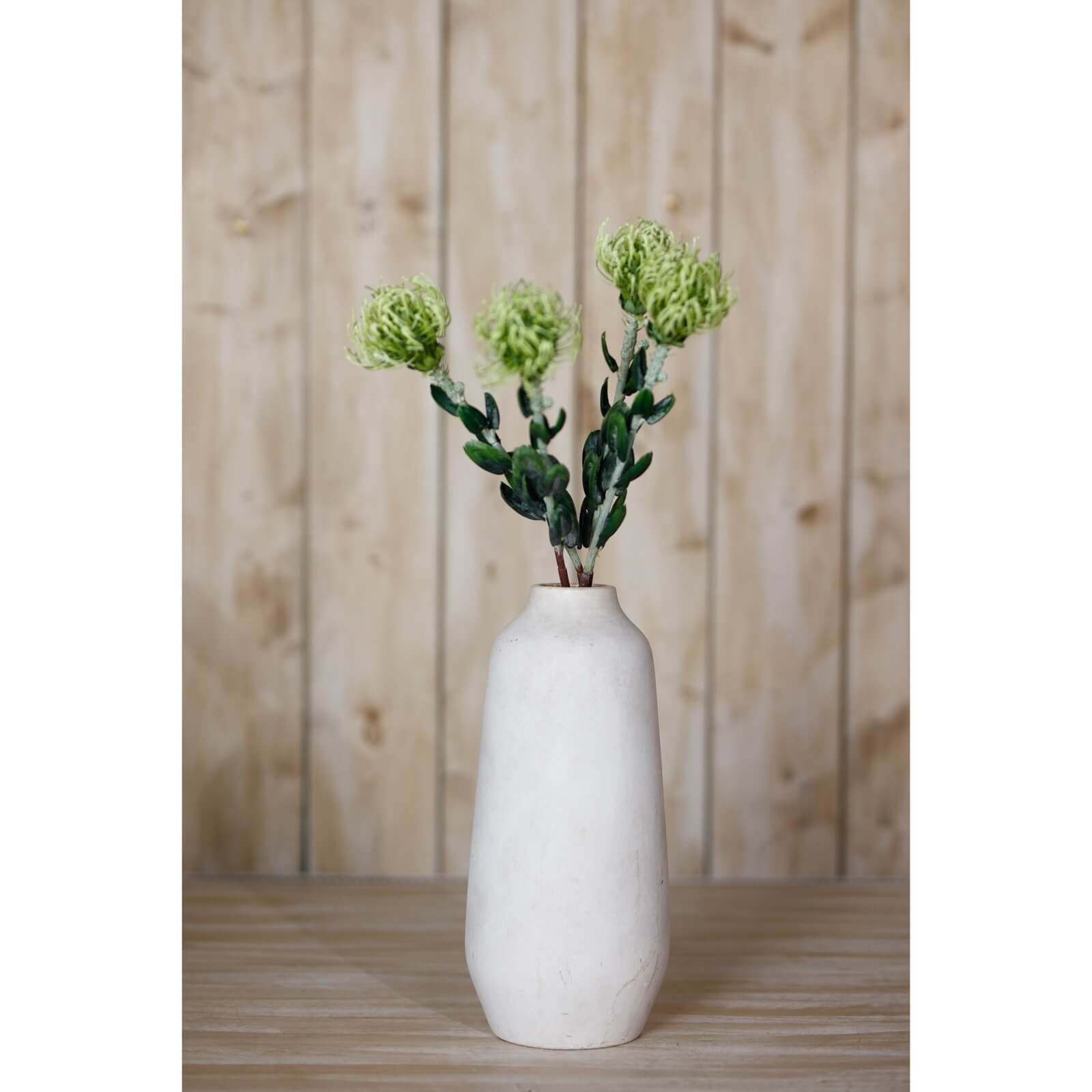 Lifelike pincushion protea spray with spherical blooms and lush green foliage, perfect for faux floral arrangements. by Sostter at brixbailey.com