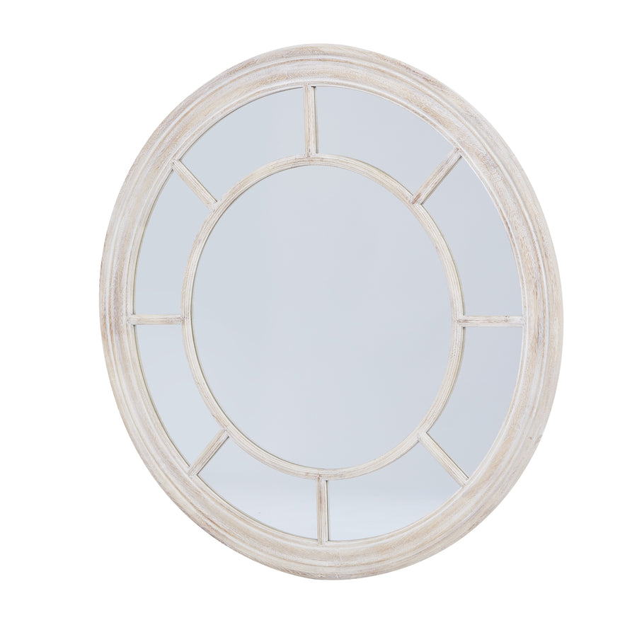 A stunning round mirror with a washed wood frame - Coastal Charm & Traditional Craftsmanship, Ideal for Chic Interiors by Hill Interiors at www.brixbailey.com