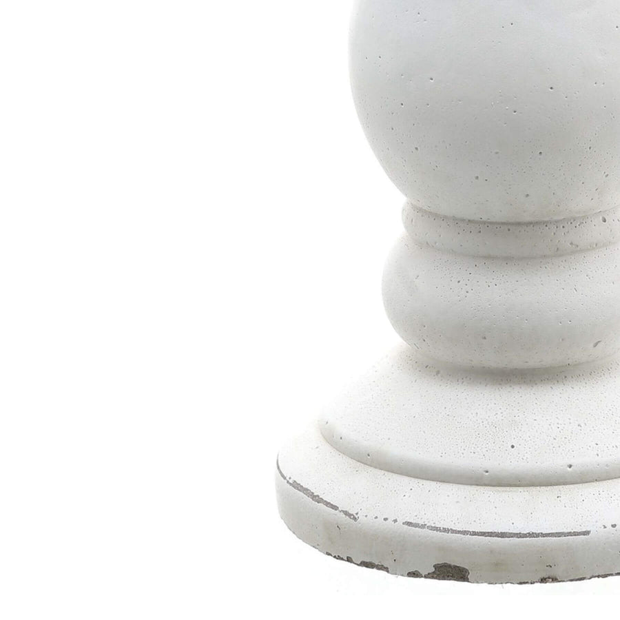 Handcrafted matte white ceramic candle holder with minimalist design for soft light diffusion in home decor by Sostter at brixbailey.com