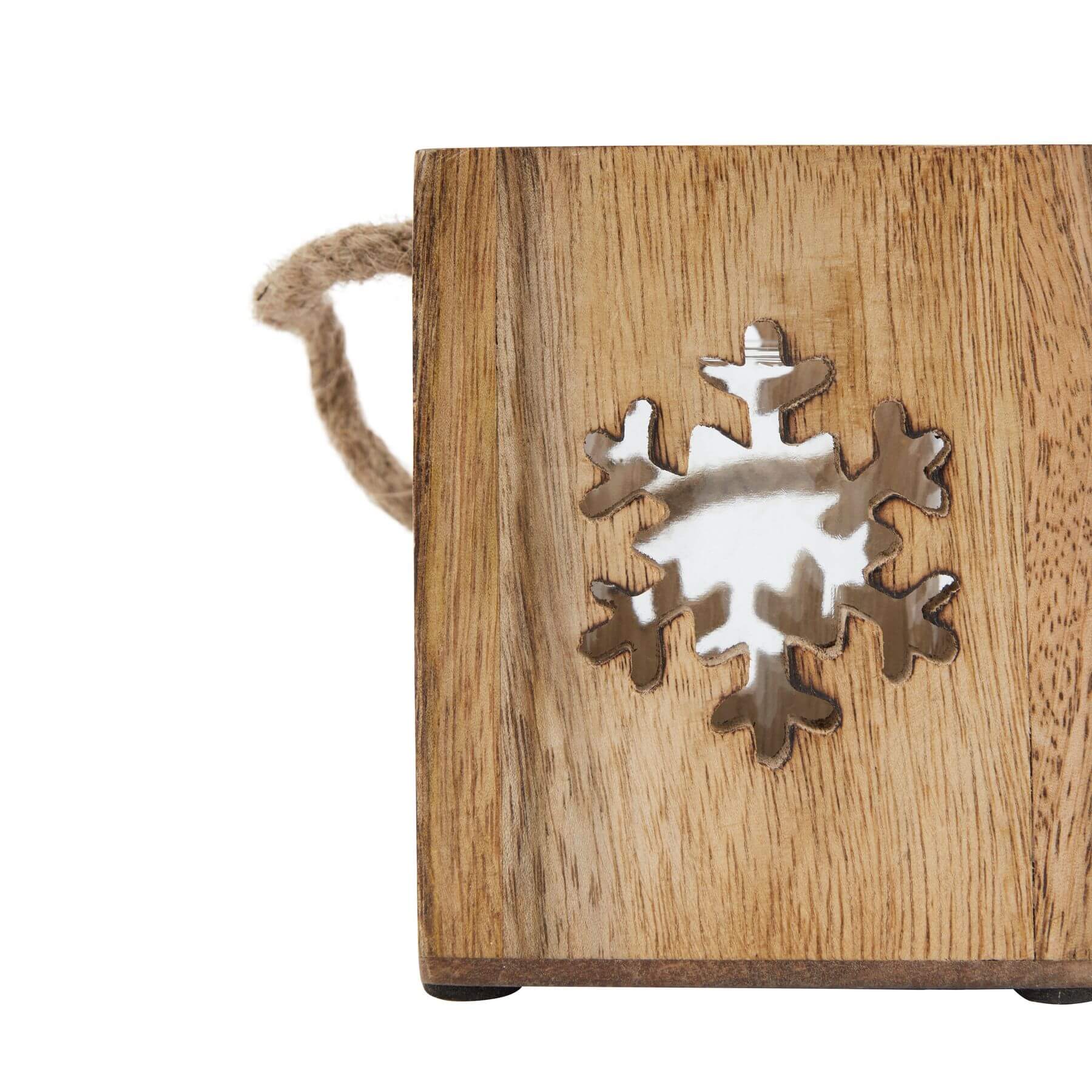 Handcrafted wooden snowflake tealight holder with glass accents, casting warm winter glow in rustic brown tones. by RoomLondon at brixbailey.com
