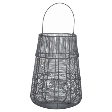 Handcrafted metal lantern with grey exterior, silver interior, intricate cutwork casting mesmerizing shadows by Sostter at brixbailey.com