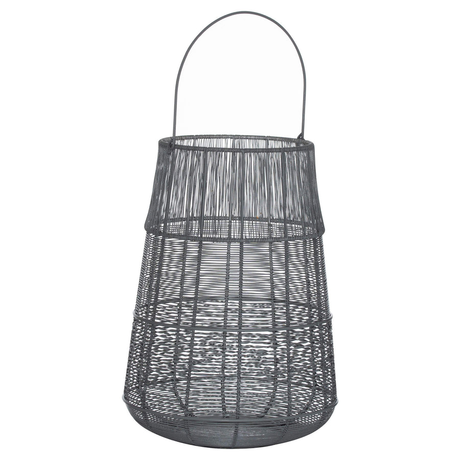 Handcrafted metal lantern with grey exterior, silver interior, intricate cutwork casting mesmerizing shadows by Sostter at brixbailey.com