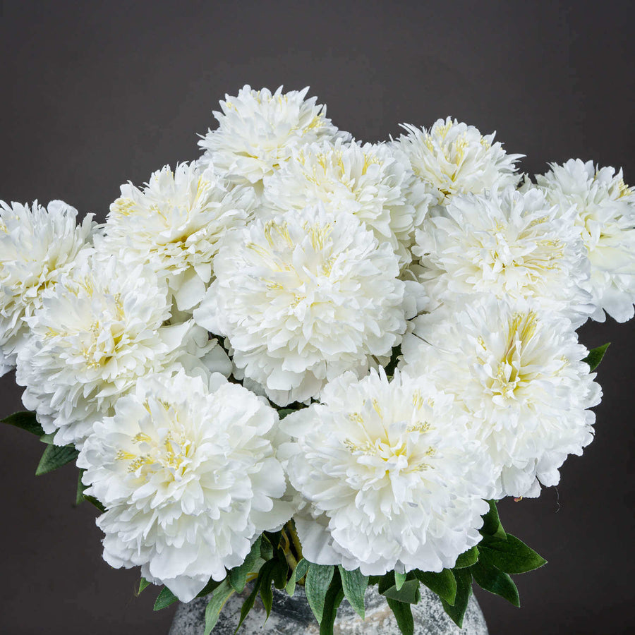Handcrafted white artificial peony with layered petals, realistic texture, and natural tonal variations for home decor. by Sostter at brixbailey.com