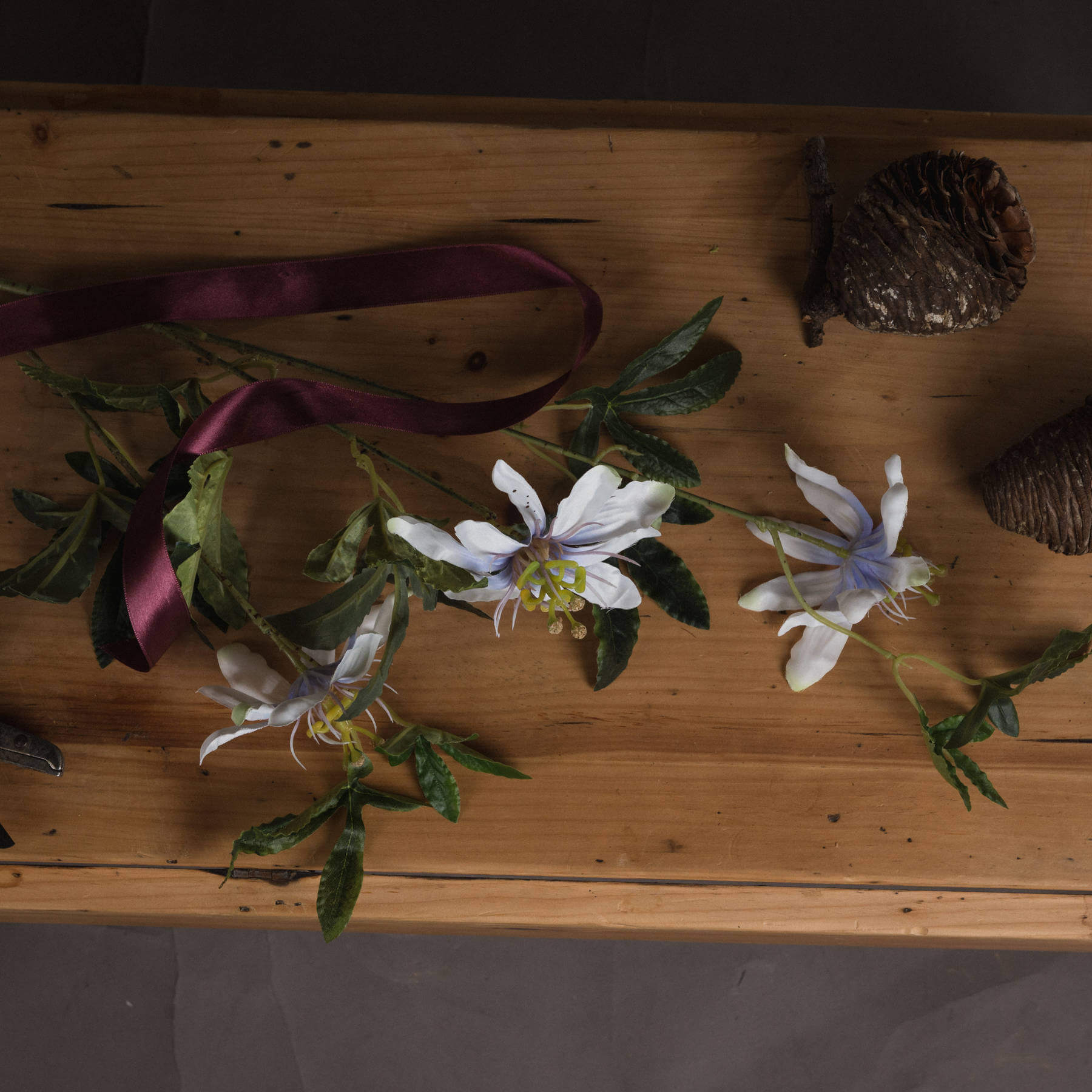 White artificial passion flower spray with lifelike petals and green foliage, 89cm tall home decor accent by Sostter at brixbailey.com