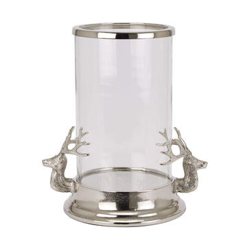 Silver Stag Heads Hurricane Lantern with glass cylinder, polished metal finish, and intricate stag accents for home decor by Sostter at brixbailey.com