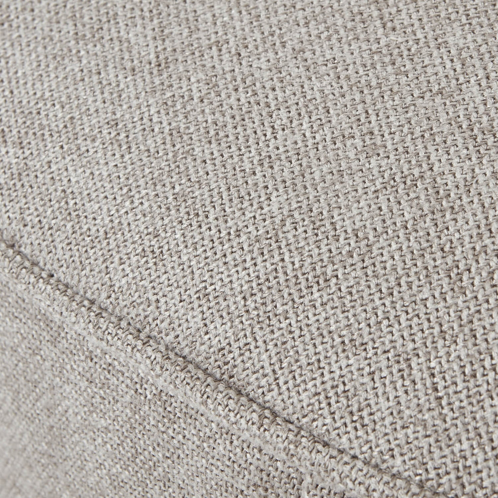 Lily Swivel Ottoman in oatmeal twill fabric with wooden base, 360-degree rotation, neutral-toned square seat by Sostter at brixbailey.com
