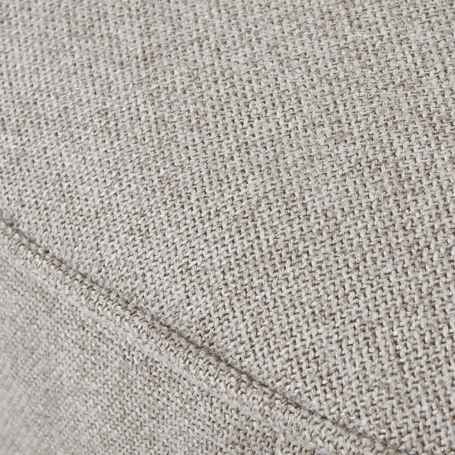 Lily Swivel Ottoman in oatmeal twill fabric with wooden base, 360-degree rotation, neutral-toned square seat by Sostter at brixbailey.com