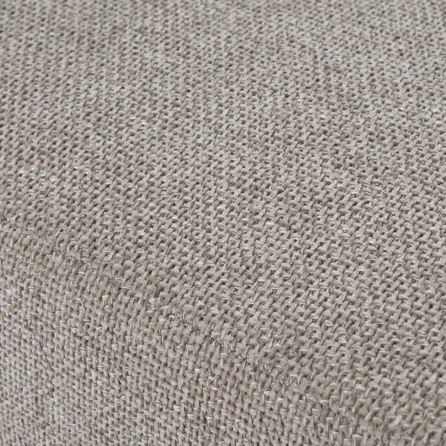 Taupe velvet ottoman footstool with wooden legs, plush cushioning, and modern farmhouse design by Sostter at brixbailey.com