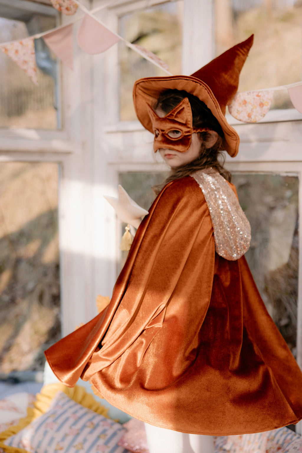 bold ginger velour hooded cape with a dramatic snap closure, ready for adventure