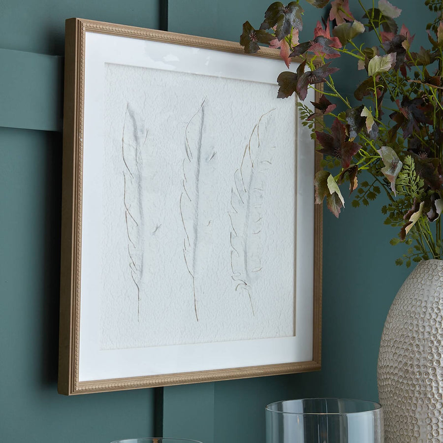 White feather artwork in champagne wood frame, textured minimalist design for modern interiors by Sostter at brixbailey.com