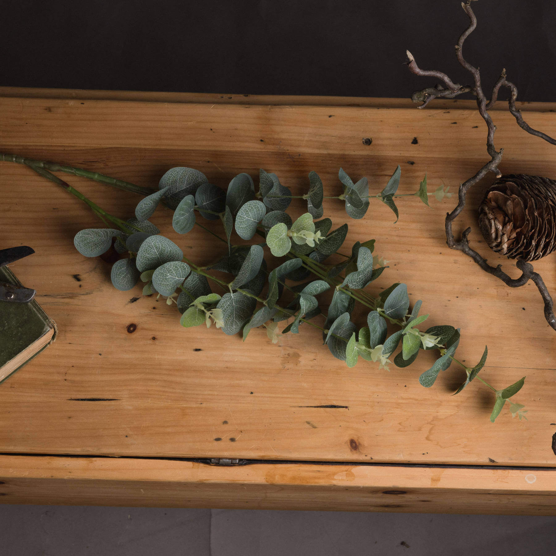 Lifelike 70cm artificial eucalyptus spray with silver-green leaves, perfect for rustic or modern home decor. by Sostter at brixbailey.com