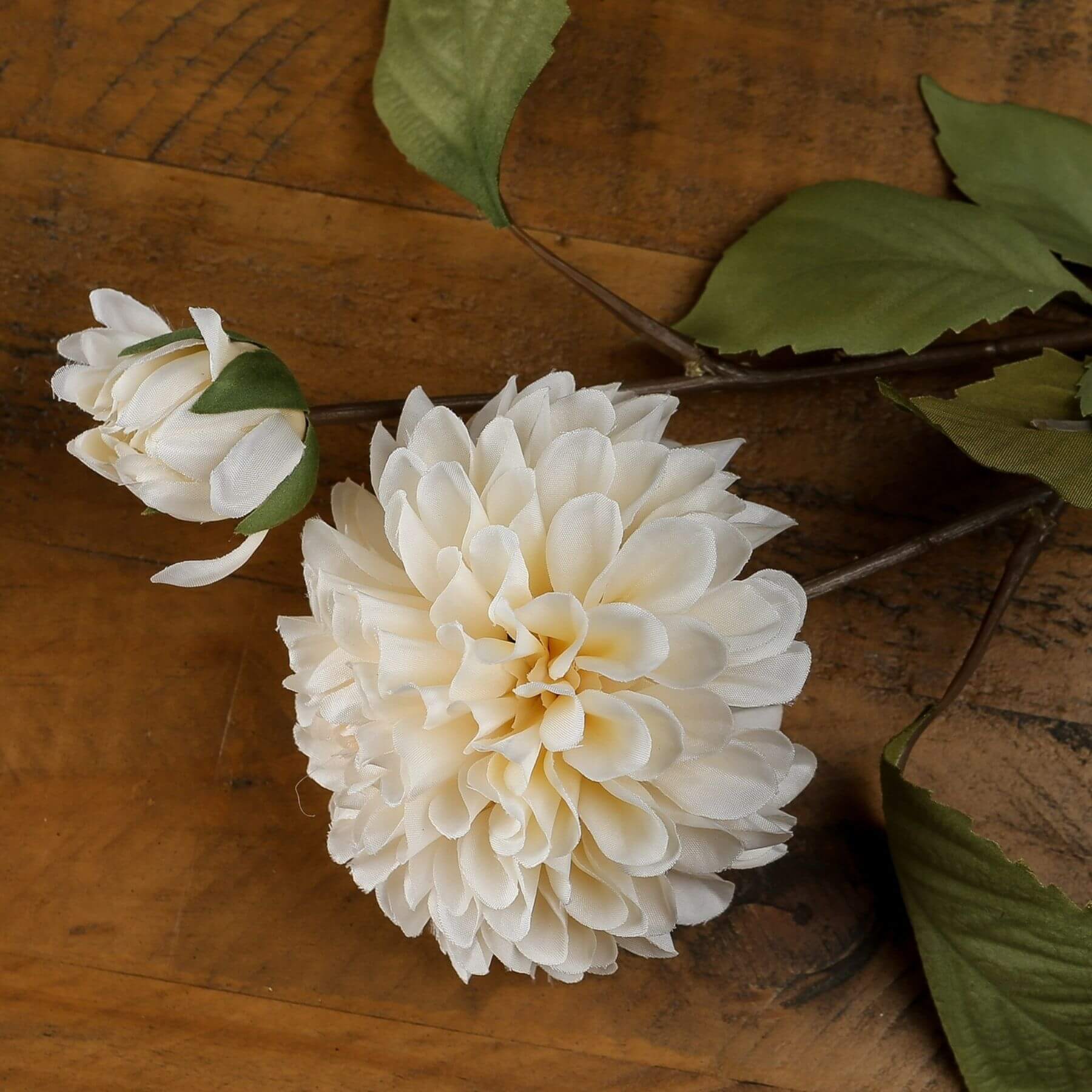 White artificial dahlia stem with lifelike layered petals, pure white color, and realistic texture, 62 cm tall. by Sostter at brixbailey.com