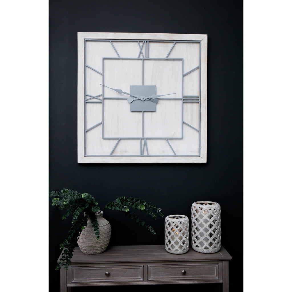 White wooden square wall clock with grey metal Roman numerals and skeleton-style face for modern farmhouse decor by Sostter at brixbailey.com