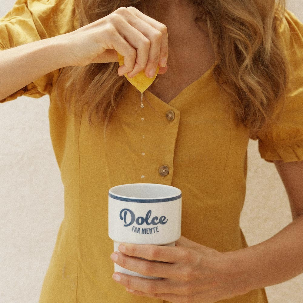 softly lit dolce far niente ceramic mug in a cozy morning setting